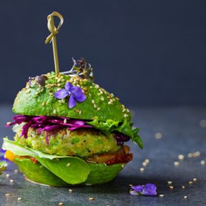 a veggie burger with avocados instead of buns