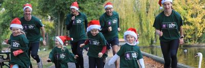 adults and children running in their goal mile tshirts on christmas day