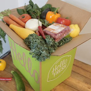 HelloFresh cardboard box filled with fresh fruits and vegetables